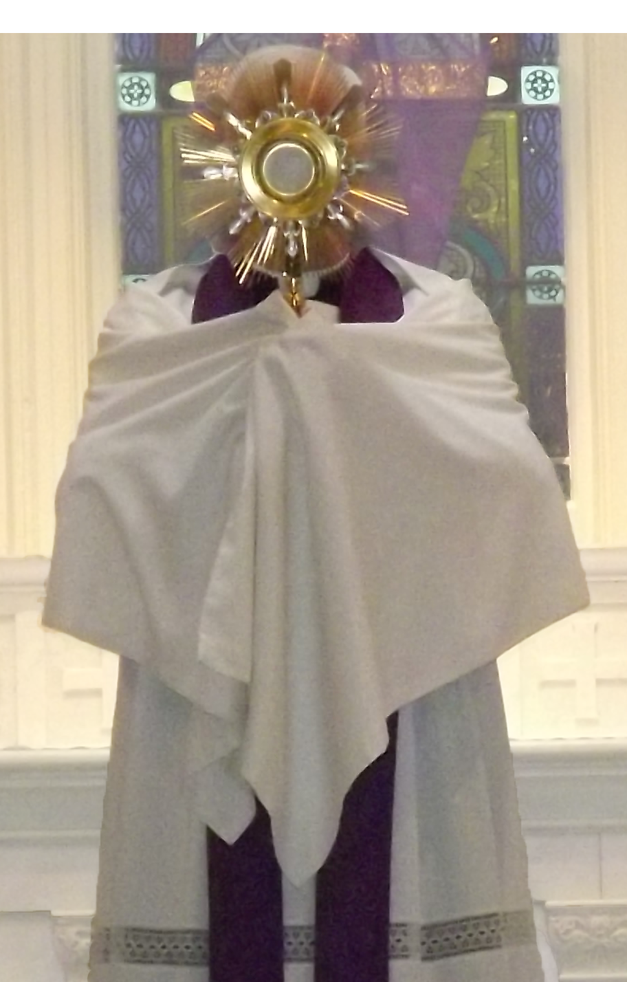 priest holding monstrance